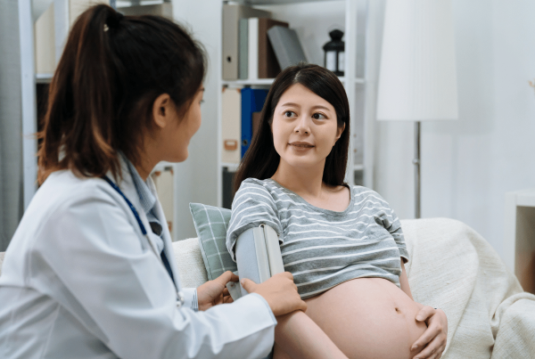 Role of the GP in pregnancy - GP and pregnant woman in consulting room